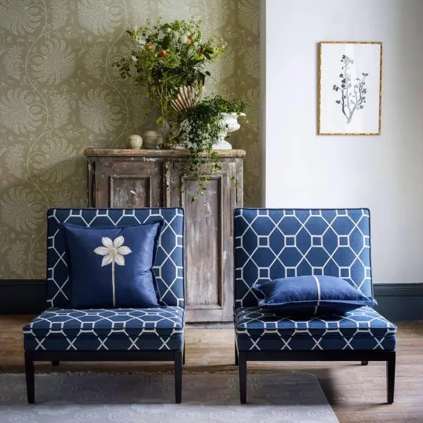 Blue upholstery fabric with a repeating geometric trellis lattice