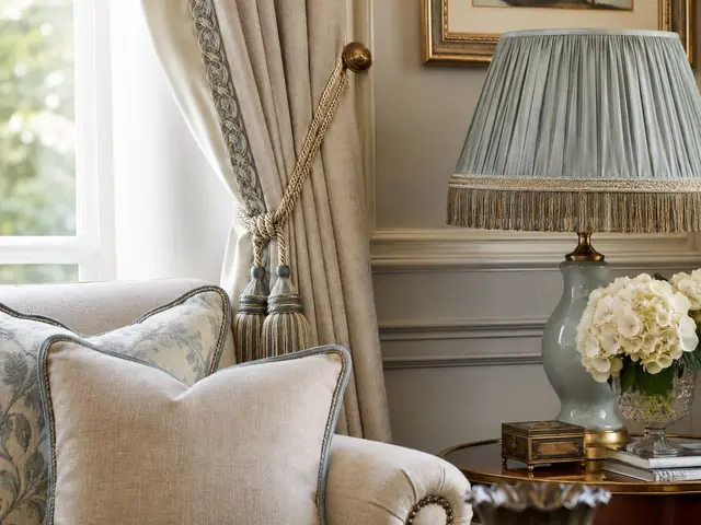 Curtain, cushions and lampshade finished with decorative braids, cords and tassels