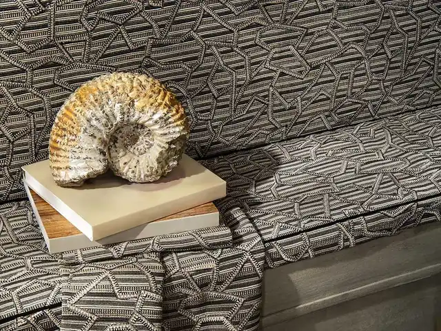 Dark grey and cream geometric fabric on upholstered seating