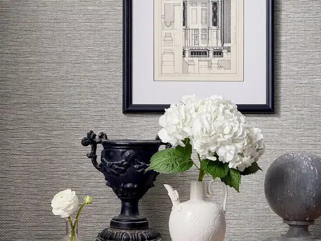 Grey grasscloth wallcovering close-up showing woven texture and tonal variation