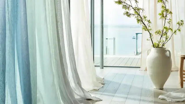 Harlequin curtain and sheer fabrics at a contemporary window