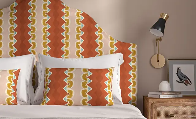Shaped upholstered headboard in a colourful patterned fabric