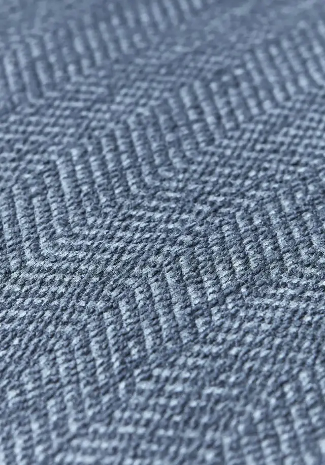 Close view of a blue herringbone weave