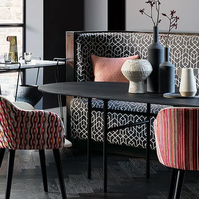 Patterned upholstery on restaurant chairs and banquette seating