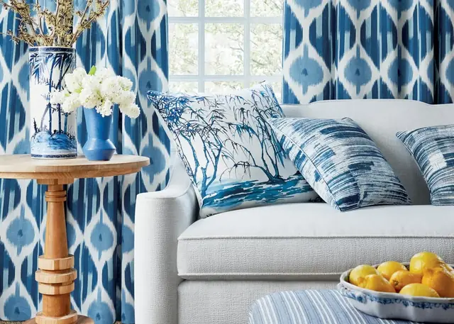 Blue Ikat-inspired curtains in a light contemporary living room