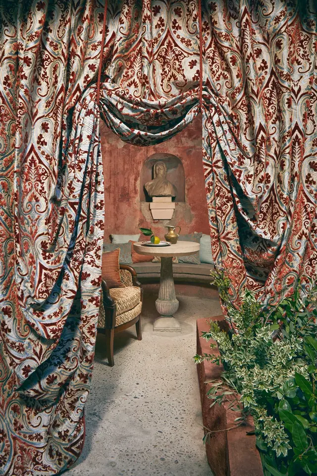 Large-scale decorative jacquard curtain fabric arranged in generous folds