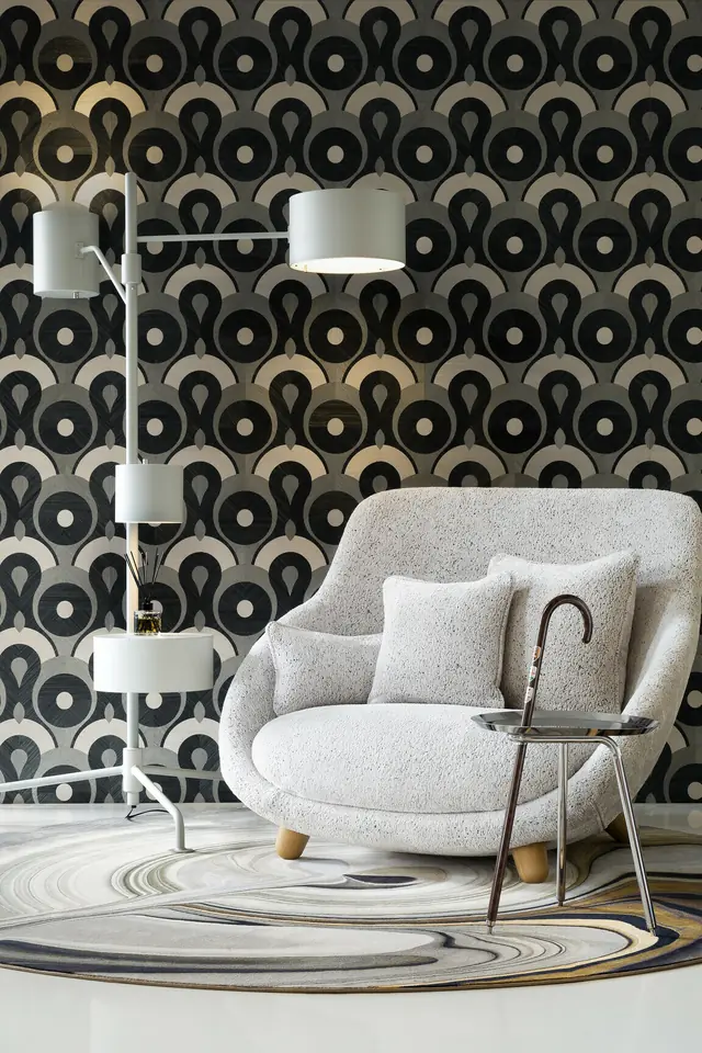Bold black and white circular wallpaper in a contemporary room
