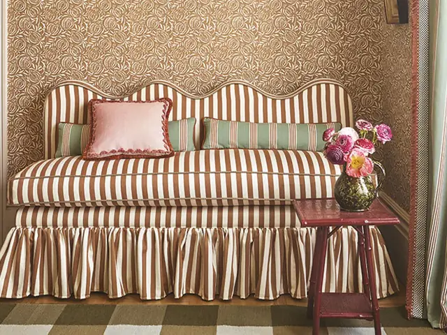 Romo Averly striped fabric used on a sofa with coordinating curtains