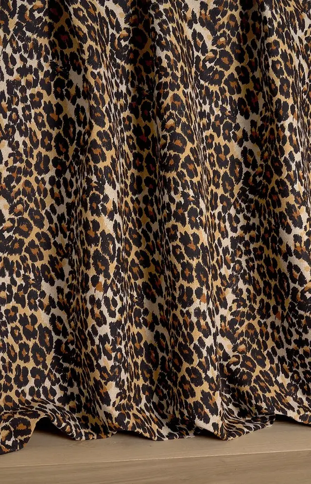 Full-length curtains in a brown and black leopard print fabric