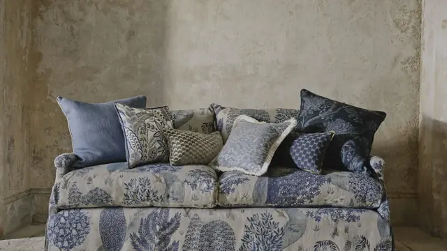 Blue botanical Liberty fabric sofa with coordinating cushions