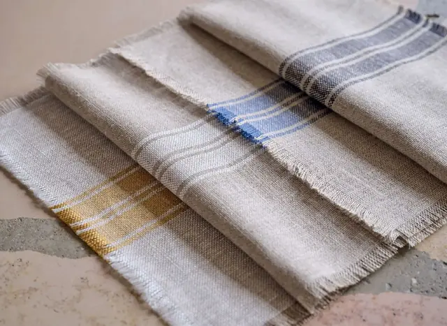 Neutral linen fabric samples with coloured woven stripes