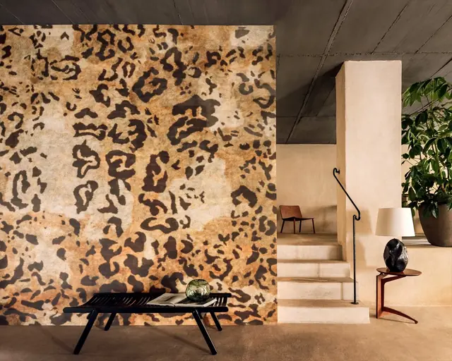 Luxury leopard print wallpaper creating a statement wall in a contemporary interior by Élitis