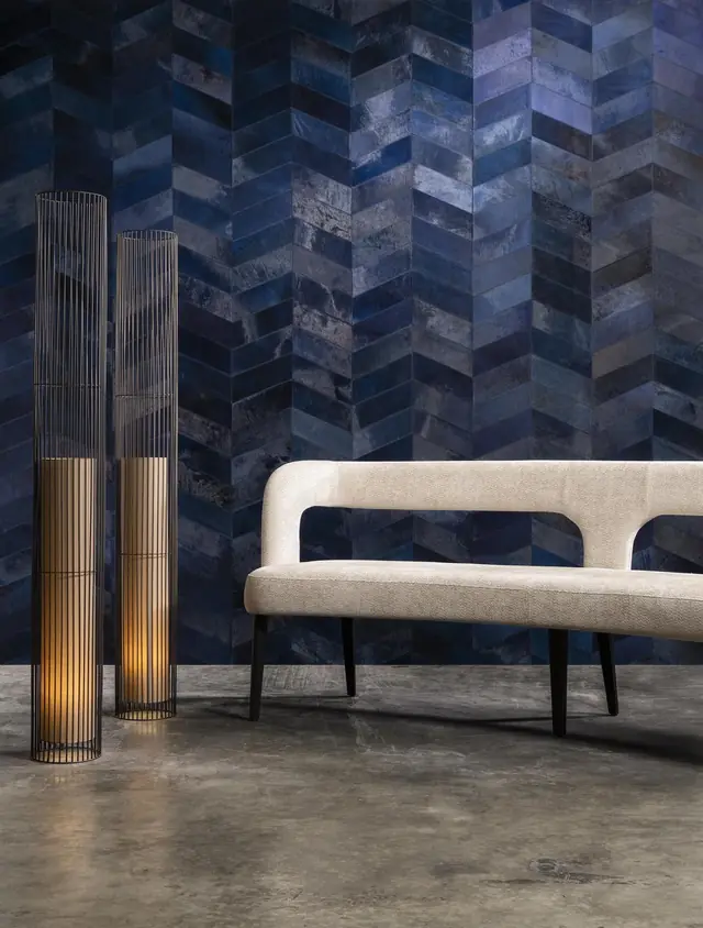 High-end specialist wallcovering showing rich material, tonal variation and architectural pattern