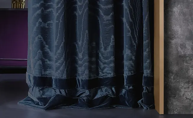 Full-length blue washable curtain fabric in a contemporary interior