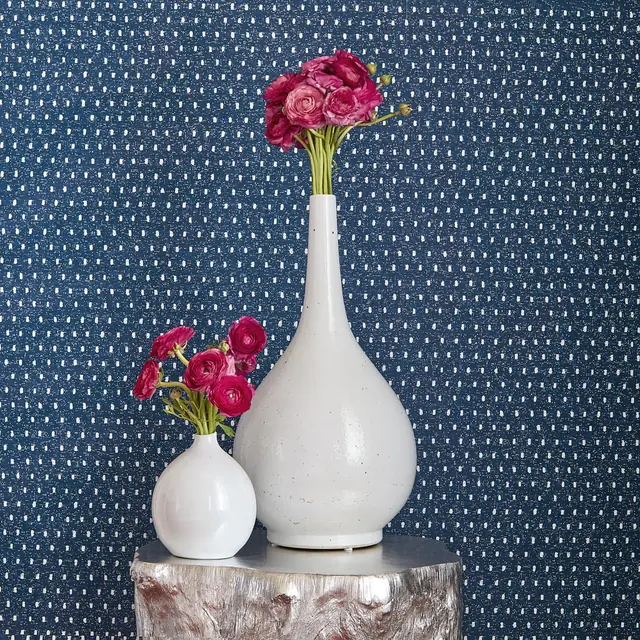 Close-up of small white dot wallpaper on a dark blue ground