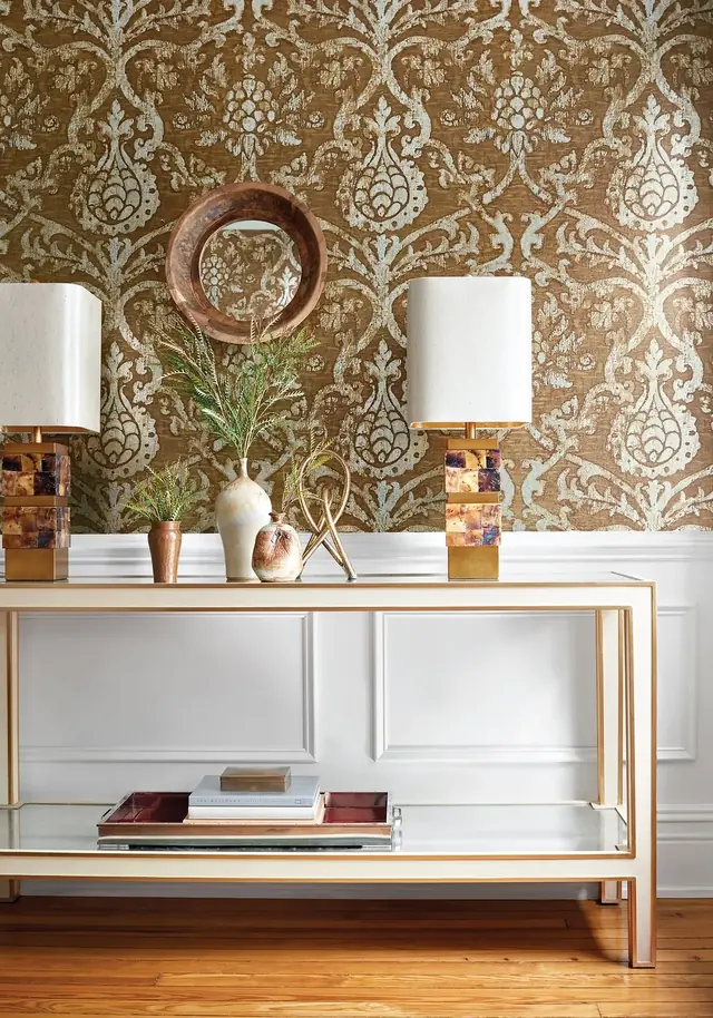 Metallic gold Thibaut Pravata damask wallpaper in an elegant hallway