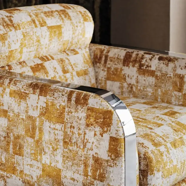 Gold and ivory metallic upholstery fabric on a statement armchair