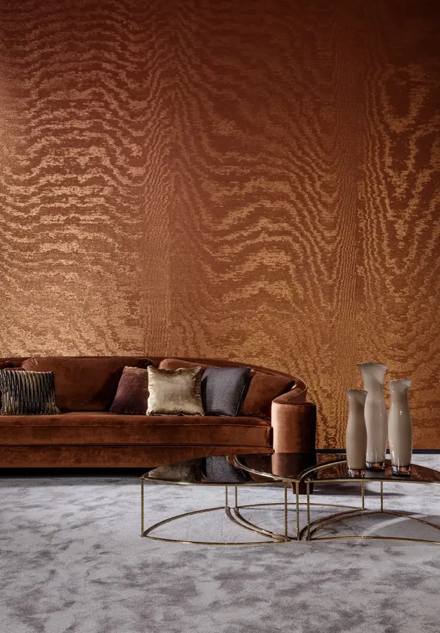 Sunset orange moiré textile wallcovering with a large random watered pattern
