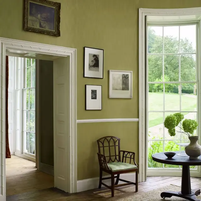 Hessian green cotton moiré wallcovering in a traditional interior
