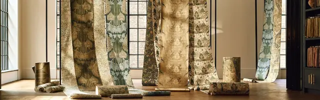 A selection of Morris and Co wallpaper designs displayed together