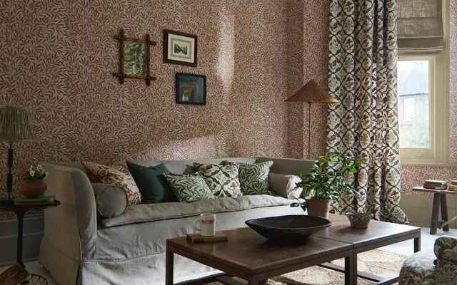 Morris and Co patterned curtains in a layered living room