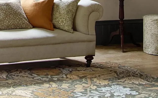 Morris and Co patterned rug in a living room