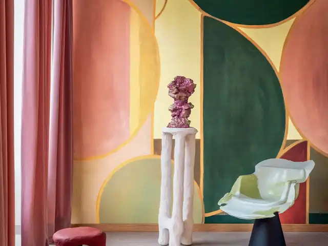 Large multicoloured abstract geometric mural in a contemporary room