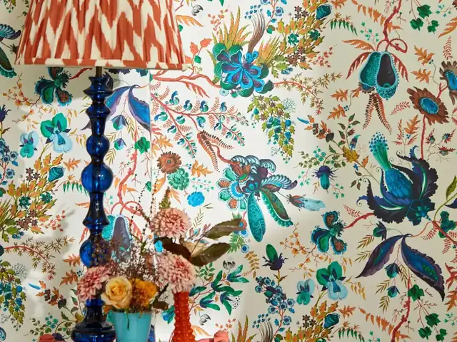 Close-up of multicoloured floral wallpaper showing its complete palette and printed detail