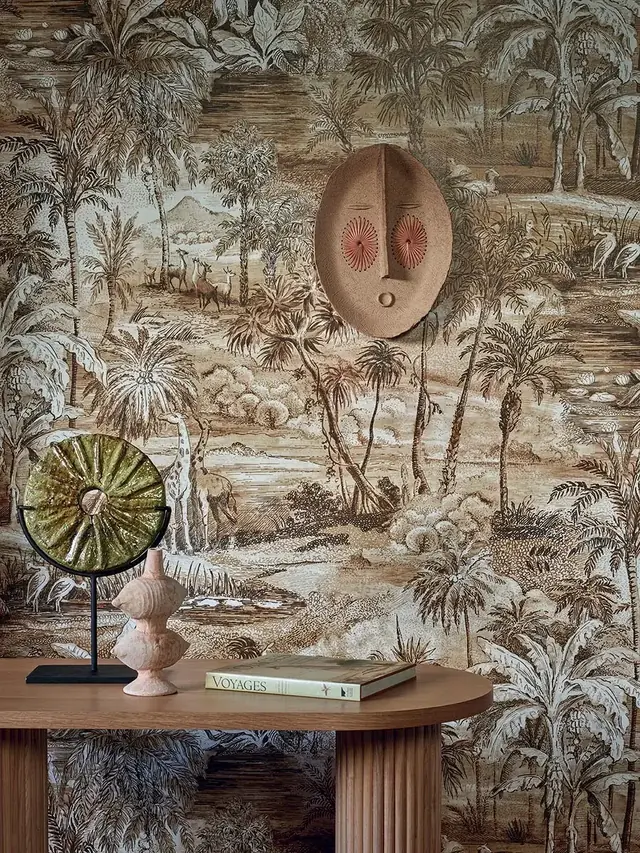 Neutral safari animal wallpaper with elephants and palm trees in an elegant interior
