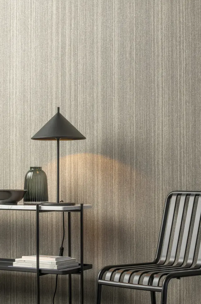 Neutral Omexco glass bead wallcovering with a softly striped texture in a modern room