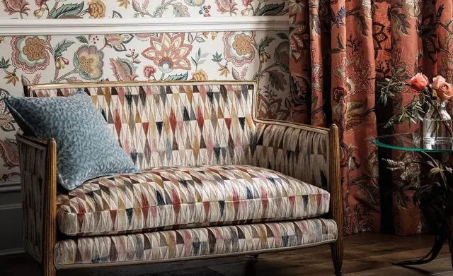 Osborne and Little patterned fabric used across curtains, upholstery and cushions
