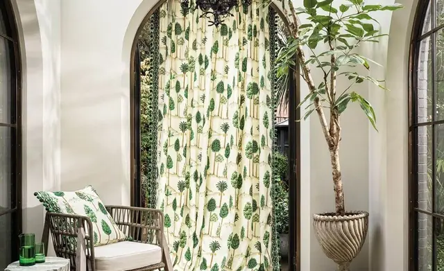Osborne and Little fabric used for full-length curtains in a furnished interior