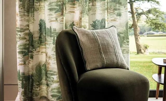 Osborne and Little patterned fabric in a calm window-side interior