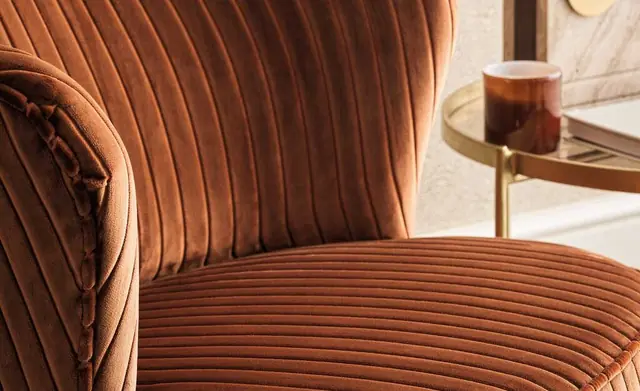 Osborne and Little Genoa cord upholstery fabric on a curved chair