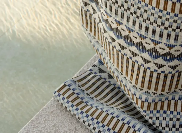 Close view of patterned outdoor upholstery and coordinating cushions