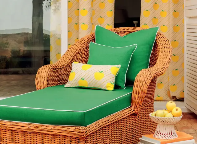Green outdoor upholstery fabric used on a woven garden lounger