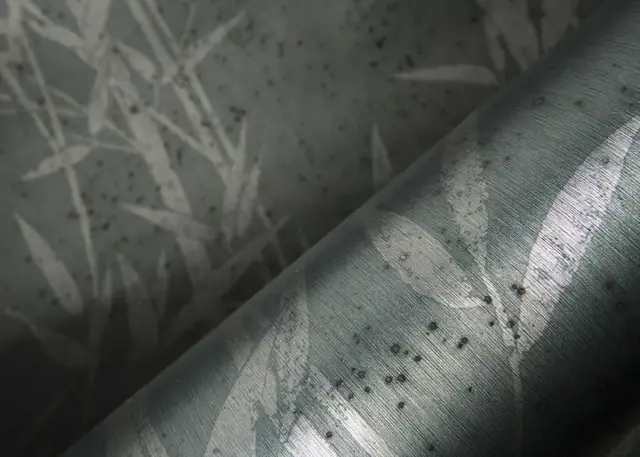 Close-up of oxidised metallic foil wallpaper with layered bronze and blue colouring