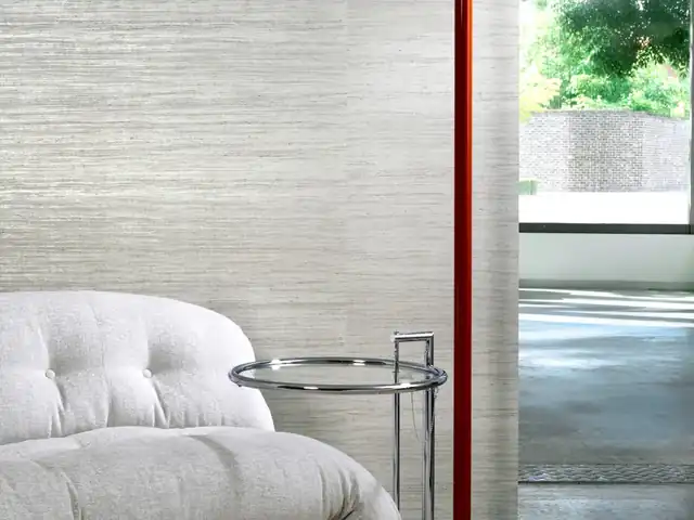 Pale grey textured wallpaper in a light contemporary room