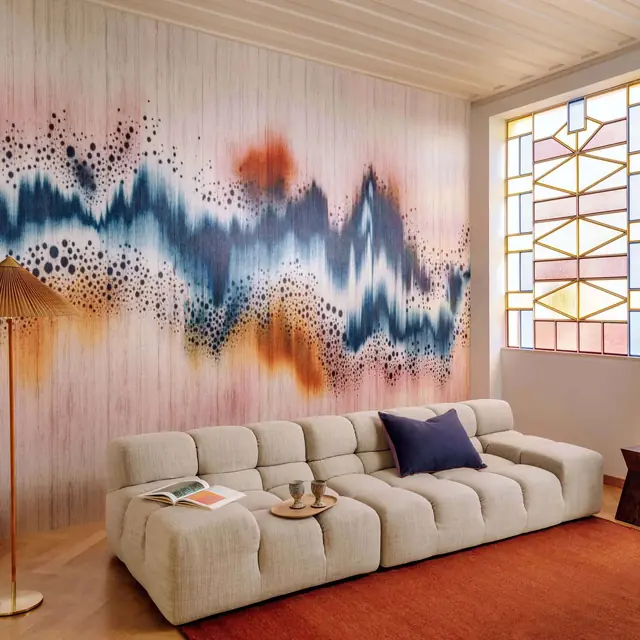 Colourful panoramic designer wallcovering in a contemporary living room