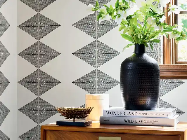 Black, white and grey geometric wallpaper with architectural diamond pattern