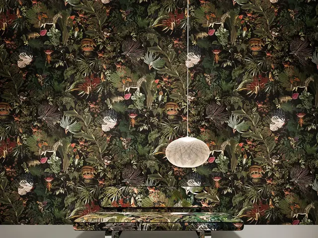 Dark botanical and animal patterned wallpaper in a dramatic interior