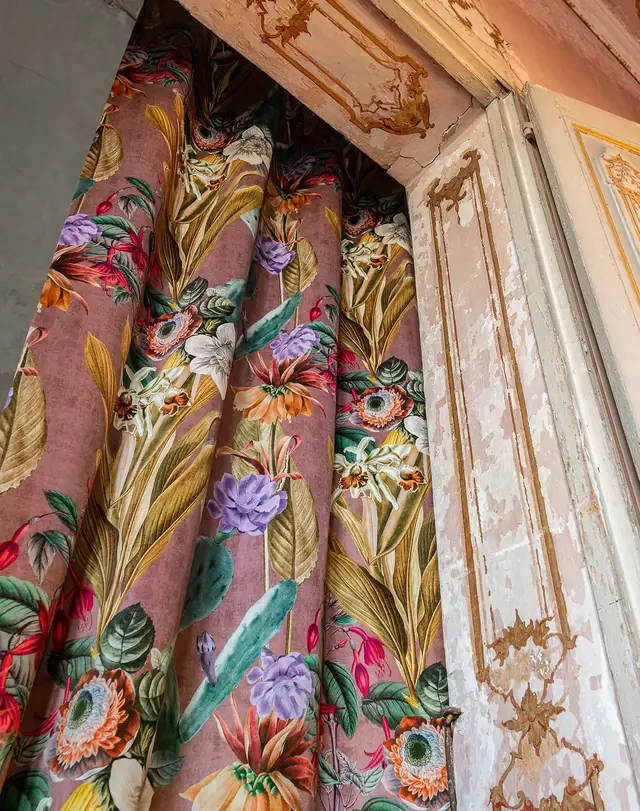 Floral viscose velvet curtain fabric in an ornate interior