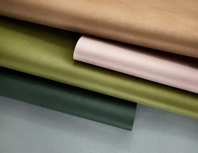 Phillip Jeffries suede wallcovering samples in green pink brown and grey