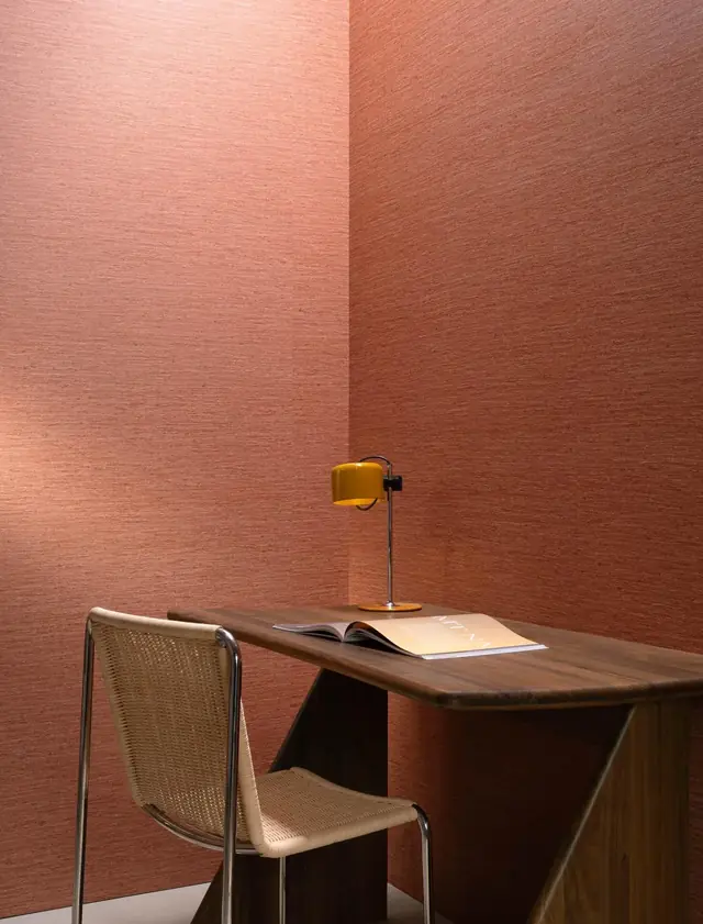 Warm rose plain silk-effect wallcovering in a modern dining space