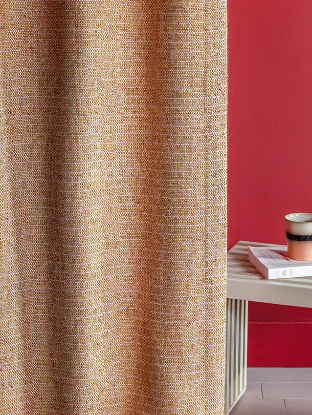 Close view of a softly textured plain wool-blend curtain