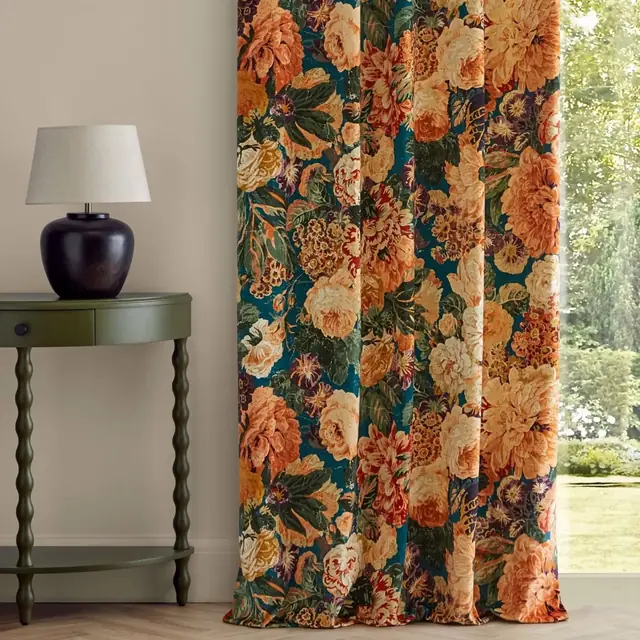 Full-length curtains in richly coloured printed floral velvet fabric