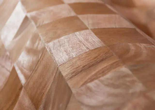 Close-up of Arte Grain real wood veneer wallpaper showing natural timber variation