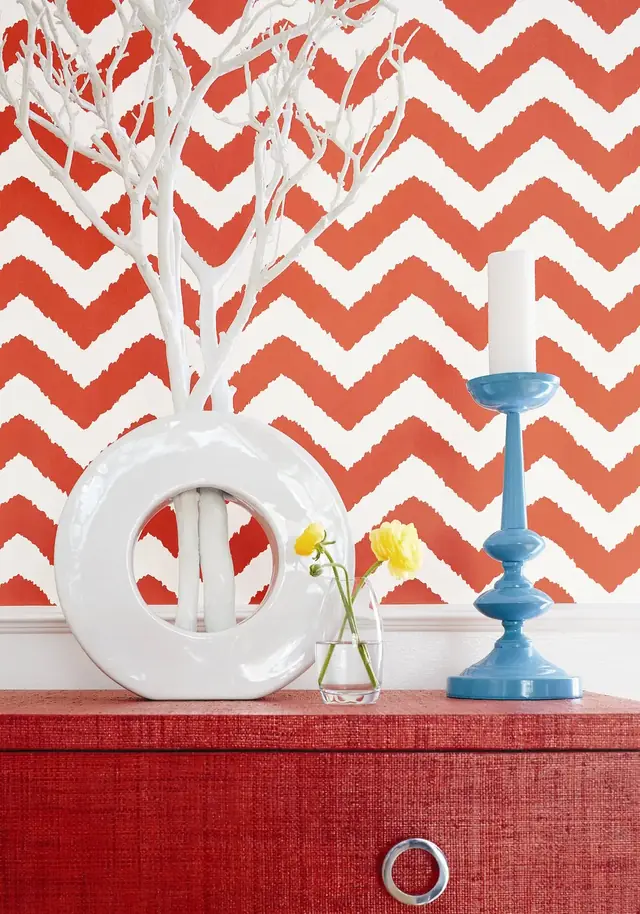 Red and white Thibaut Widenor Chevron wallpaper showing diagonal bands meeting in continuous V shapes