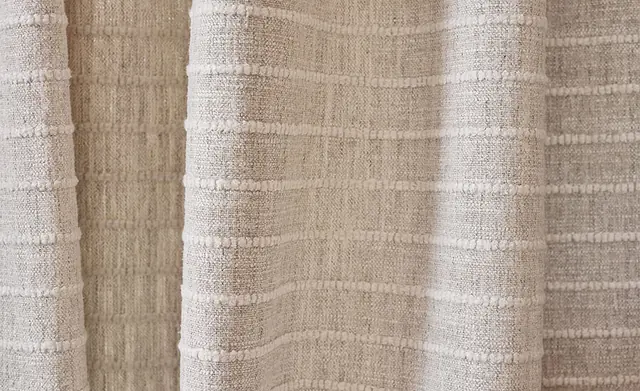 Neutral textured curtain fabric with softly raised horizontal woven bands