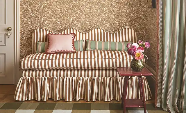 Striped sofa with patterned cushions from the Romo Averly fabric collection